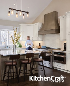 neutral kitchen with white and wooden cabinetry surrounding grey slab island